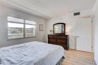 Enjoy resort-style living in Wynmoor's sought-after Antigua I