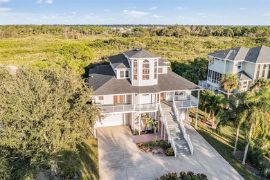 Welcome to 921 Point Seaside Drive, an elegant coastal retreat