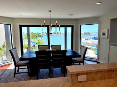 This exquisite custom waterfront residence features four