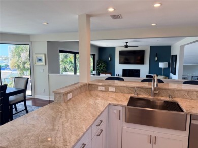 This exquisite custom waterfront residence features four