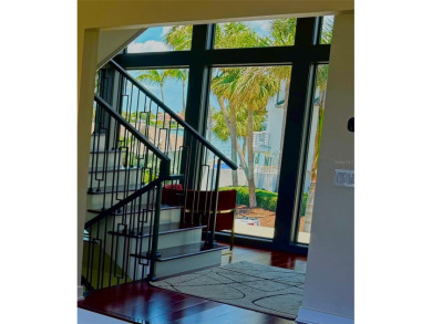 This exquisite custom waterfront residence features four