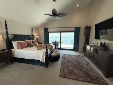 This exquisite custom waterfront residence features four