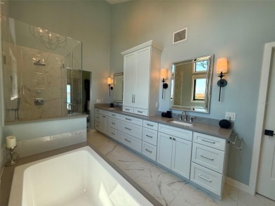 This exquisite custom waterfront residence features four