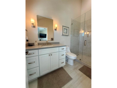 This exquisite custom waterfront residence features four