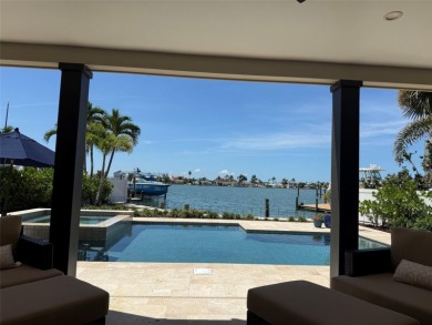 This exquisite custom waterfront residence features four