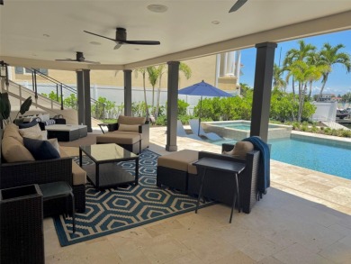 This exquisite custom waterfront residence features four