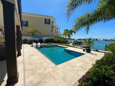 This exquisite custom waterfront residence features four