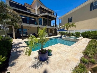 This exquisite custom waterfront residence features four