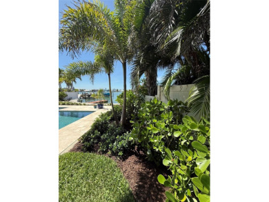 This exquisite custom waterfront residence features four