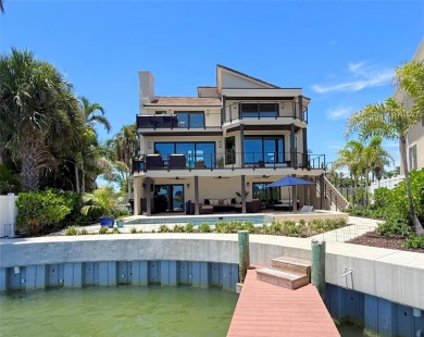 This exquisite custom waterfront residence features four