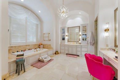 Enjoy the elegance of this custom, over 9,000 square ft estate