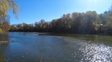 Nestled along the scenic Tippecanoe River, this stunning river