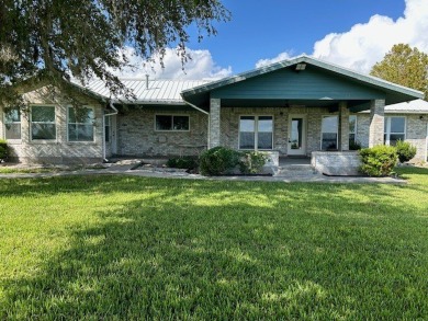 A TRUE LAKEFRONT HOME -- With a 395 foot frontage, the residence