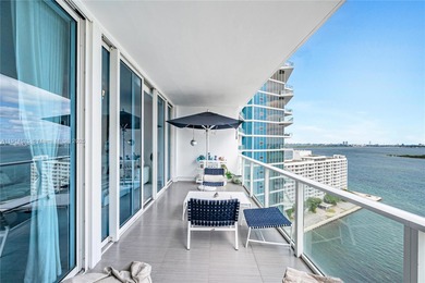 Experience refined waterfront living in this expansive unit