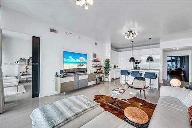 Experience refined waterfront living in this expansive unit