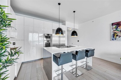 Experience refined waterfront living in this expansive unit