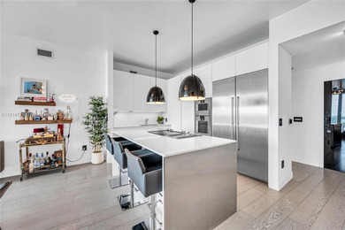 Experience refined waterfront living in this expansive unit