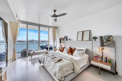 Experience refined waterfront living in this expansive unit