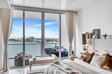 Experience refined waterfront living in this expansive unit