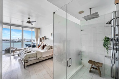 Experience refined waterfront living in this expansive unit