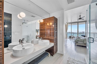 Experience refined waterfront living in this expansive unit