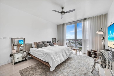 Experience refined waterfront living in this expansive unit