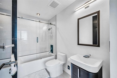 Experience refined waterfront living in this expansive unit