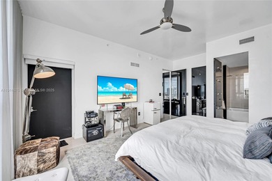 Experience refined waterfront living in this expansive unit