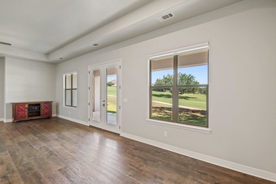 Enjoy tranquil golf course living and sweeping views from this