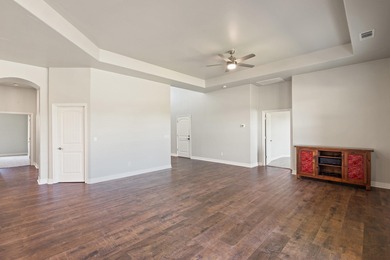 Enjoy tranquil golf course living and sweeping views from this