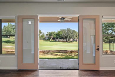 Enjoy tranquil golf course living and sweeping views from this