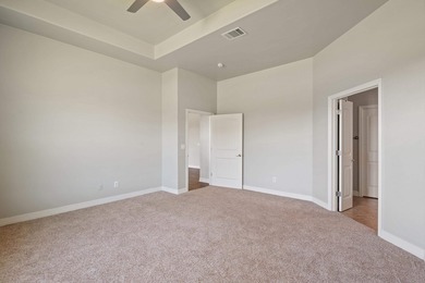 Enjoy tranquil golf course living and sweeping views from this