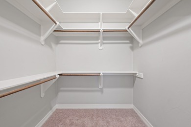 Enjoy tranquil golf course living and sweeping views from this