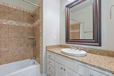 Enjoy tranquil golf course living and sweeping views from this