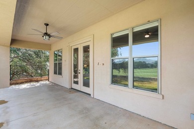 Enjoy tranquil golf course living and sweeping views from this