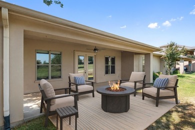 Enjoy tranquil golf course living and sweeping views from this