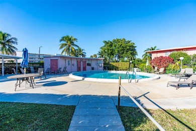 Just footsteps from the pool, this beautiful corner unit