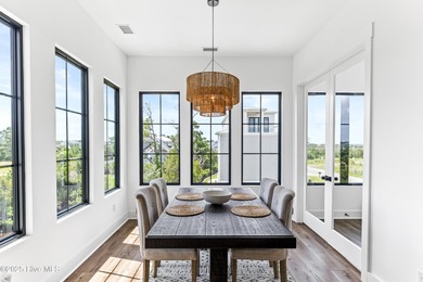 Imagine gliding home along River Road at golden hour, the Cape