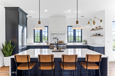 Imagine gliding home along River Road at golden hour, the Cape