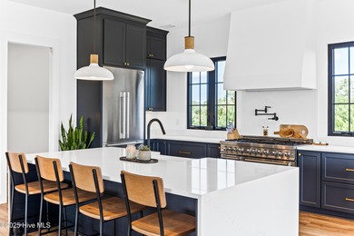 Imagine gliding home along River Road at golden hour, the Cape