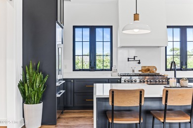 Imagine gliding home along River Road at golden hour, the Cape