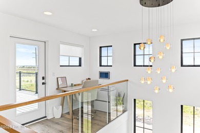 Imagine gliding home along River Road at golden hour, the Cape