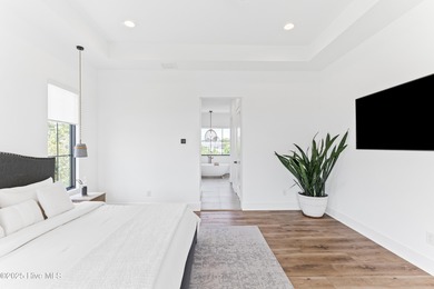 Imagine gliding home along River Road at golden hour, the Cape