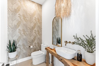 Imagine gliding home along River Road at golden hour, the Cape