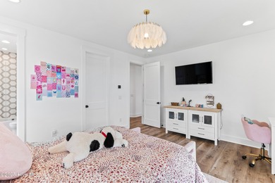 Imagine gliding home along River Road at golden hour, the Cape