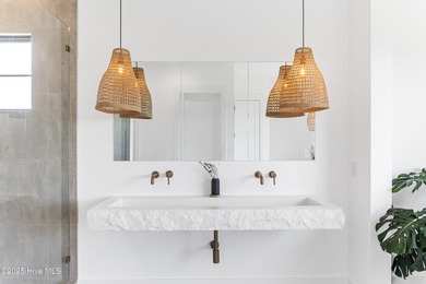 Imagine gliding home along River Road at golden hour, the Cape