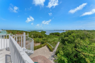 Stunning 4-Story Mediterranean Estate in Exclusive Stirrup Key -