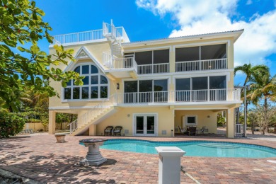 Stunning 4-Story Mediterranean Estate in Exclusive Stirrup Key -