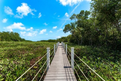 Stunning 4-Story Mediterranean Estate in Exclusive Stirrup Key -