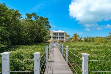 Stunning 4-Story Mediterranean Estate in Exclusive Stirrup Key -